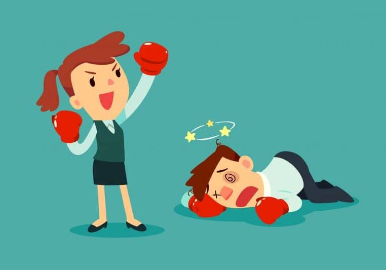 Businesswoman in boxing gloves won the fight against businessman. Business competition concept.